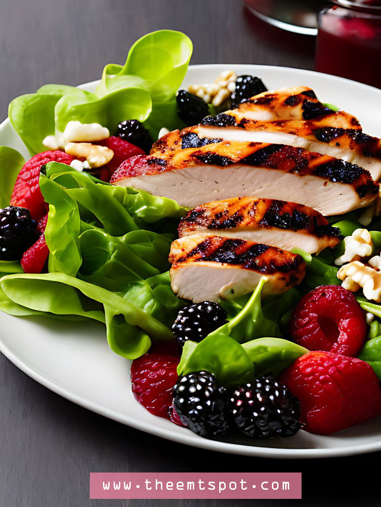 Grilled chicken salad with mixed berries and walnuts